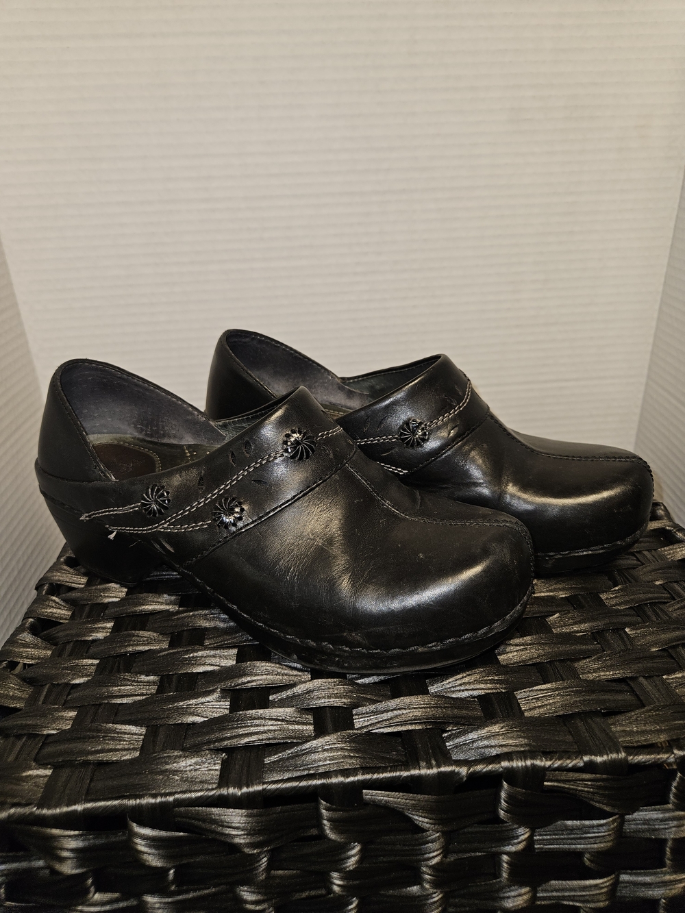 Dansko Black Leather Women's Clogs with Floral Accent
